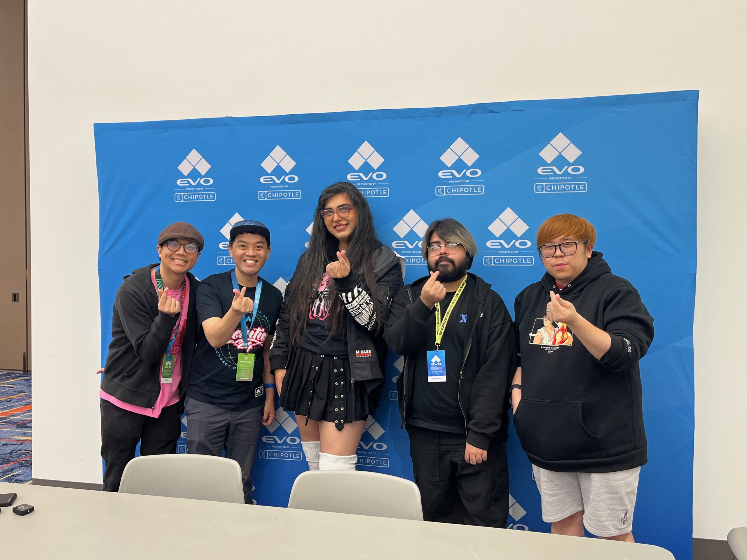 Jason Yu and cameraman James at EVO with VTuber Miles and pro players Supernoon and Justin Wong